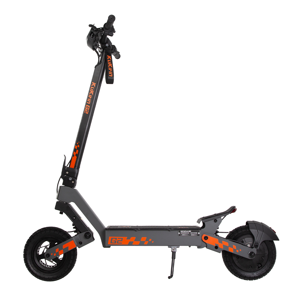 A KUKIRIN G2 electric scooter in gray with orange accents, featuring a front suspension system, large wheels, and a rear basket.